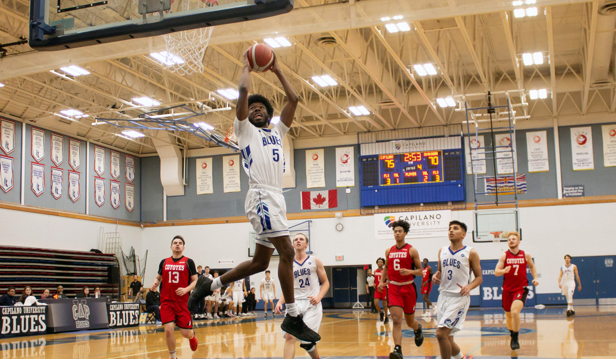 Tyrone Asenoguan soars to the rack, finishing a 360-dunk in style as the Blues downed visiting Okanagan College 85-76 on Dec. 2. 