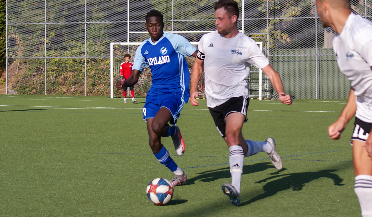 Ezra Kambidi pursues a VIU ballcarrier in an Oct. 2 meeting that VIU won 2-1.